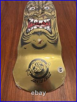 Santa Cruz Skateboard Deck Rob Roskopp Face Gold