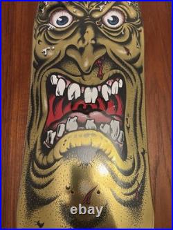 Santa Cruz Skateboard Deck Rob Roskopp Face Gold